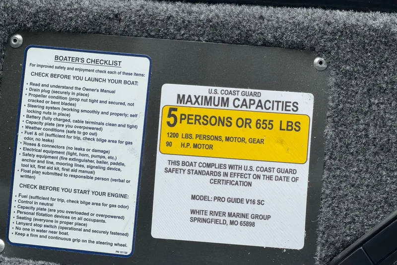 Slide: The Image of Boater's checklist and capacity label on 2027 Tracker Pro Guide V-16 SC boat. - 25