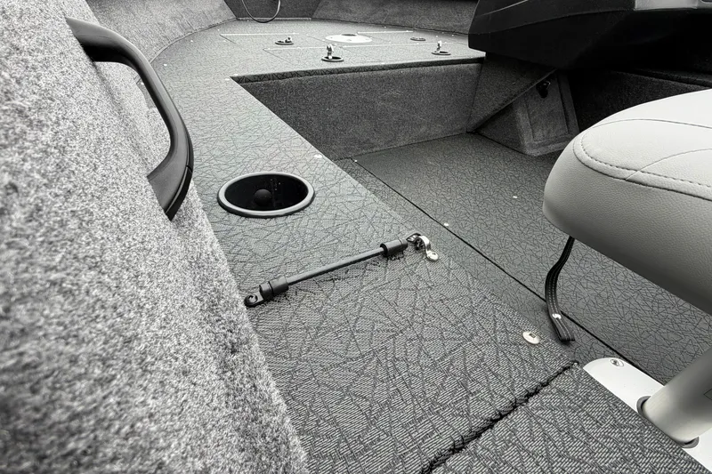 Slide: The Image of Interior of 2027 Tracker Pro Guide V-16 SC boat, featuring seating and deck details. - 17