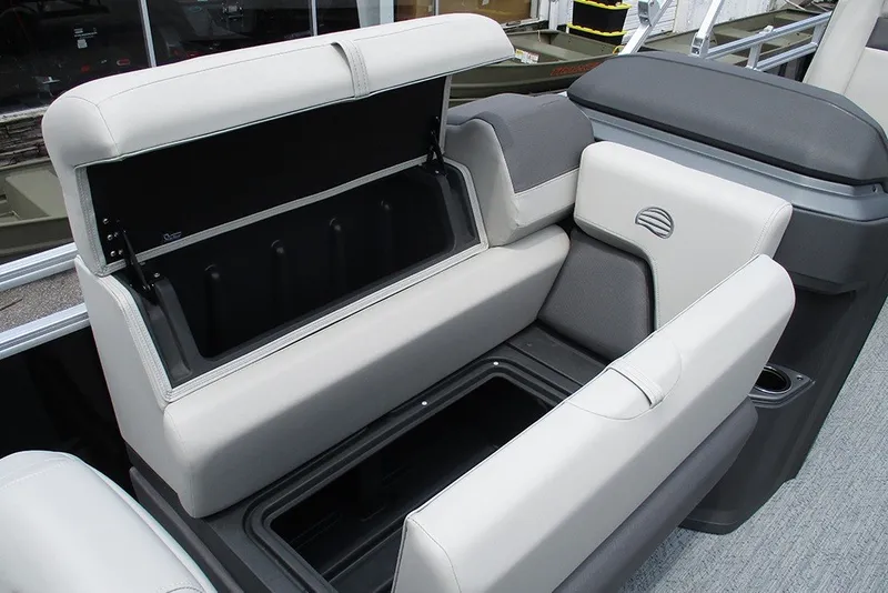 Slide: The Image of 2027 Sun Tracker Fishin' Barge 20 DLX boat seat with storage compartment open. - 18