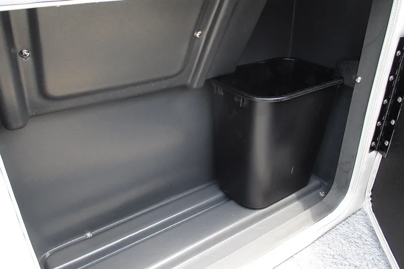 Slide: The Image of Storage compartment with black bin in 2027 Sun Tracker Fishin' Barge 20 DLX. - 23
