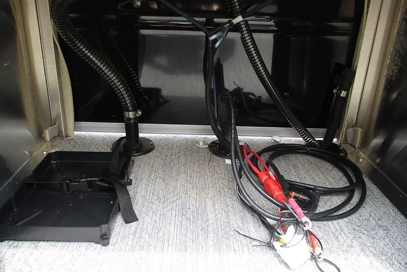 Slide: The Image of Interior wiring and components of a 2027 Sun Tracker Fishin' Barge 20 DLX boat. - 32