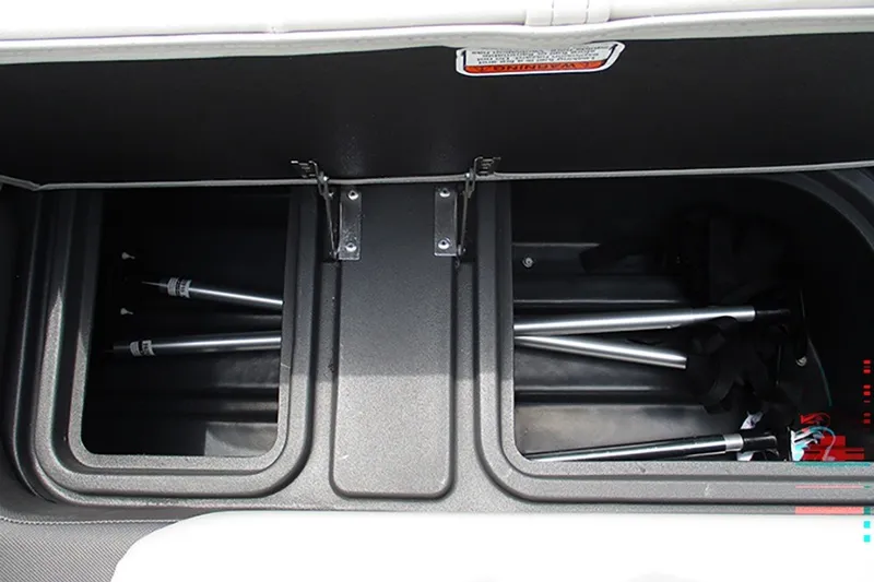 Slide: The Image of Storage compartments in 2027 Sun Tracker Fishin' Barge 20 DLX, featuring fishing gear storage. - 29