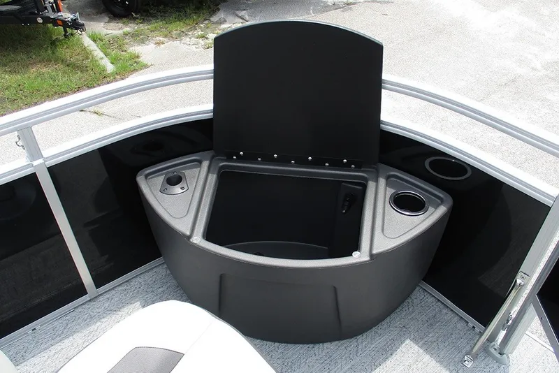 Slide: The Image of 2027 Sun Tracker Fishin' Barge 20 DLX boat interior with storage compartment and cup holders. - 15