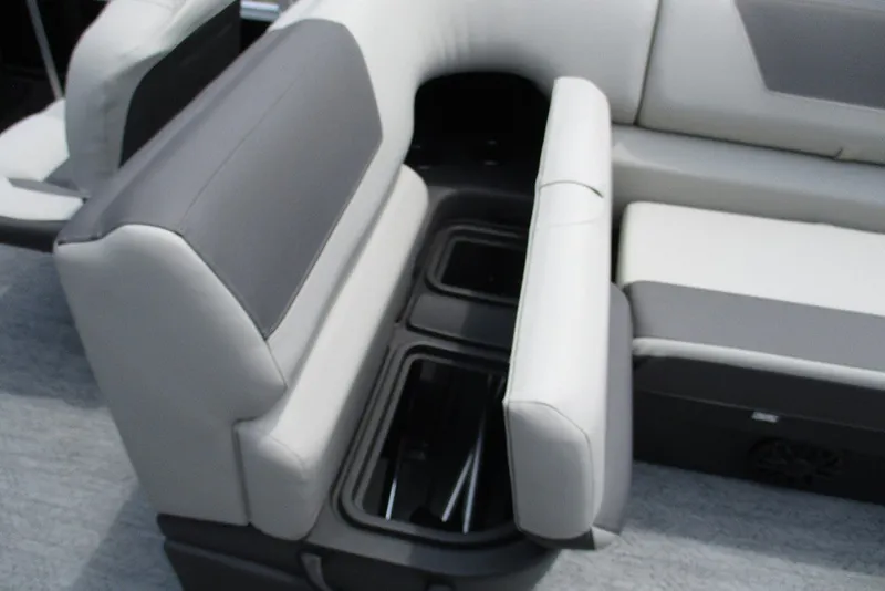 Slide: The Image of 2027 Sun Tracker Fishin' Barge 20 DLX interior seating with storage compartments. - 28