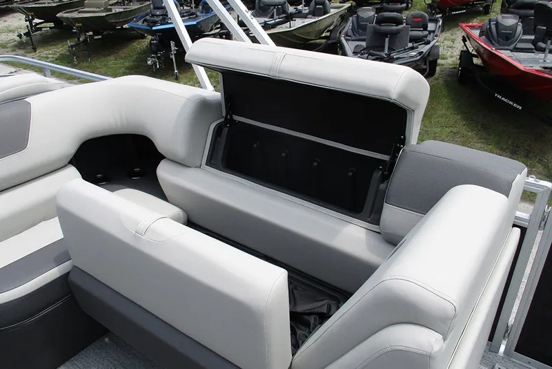 Slide: The Image of 2027 Sun Tracker Fishin' Barge 20 DLX boat interior with open storage compartment. - 25