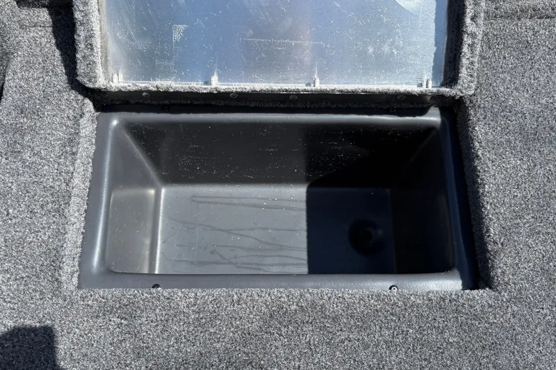 Slide: The Image of Open storage compartment in 2027 Tracker Pro Team 175 Crappie Edition boat. - 43