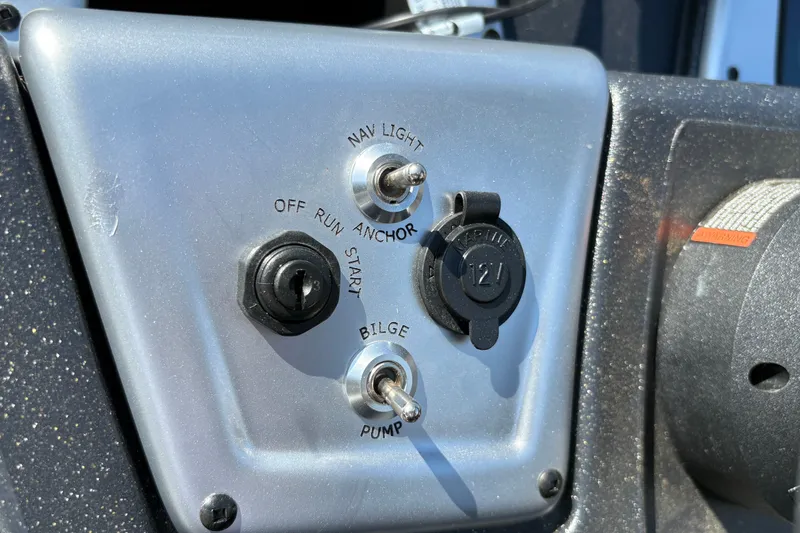 Slide: The Image of Control panel of 2027 Tracker Pro Team 175 Crappie Edition boat with switches and ignition. - 25