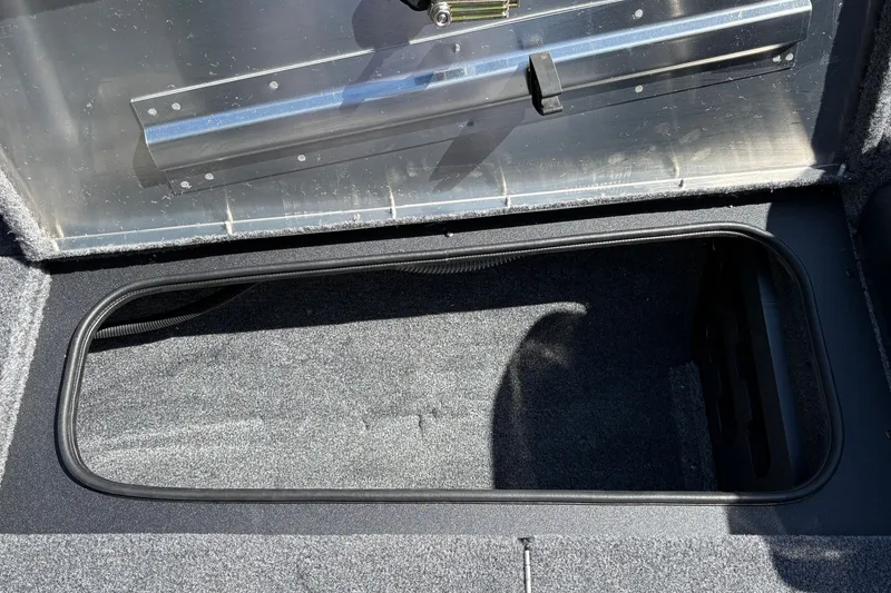 Slide: The Image of Open storage compartment in 2027 Tracker Pro Team 175 Crappie Edition boat. - 35
