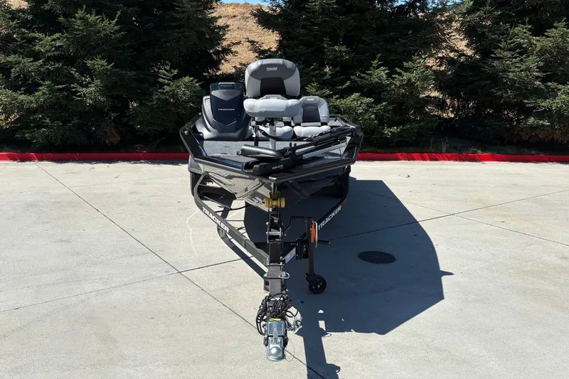 Slide: The Image of 2027 Tracker Pro Team 175 Crappie Edition boat on trailer, parked outdoors. - 14