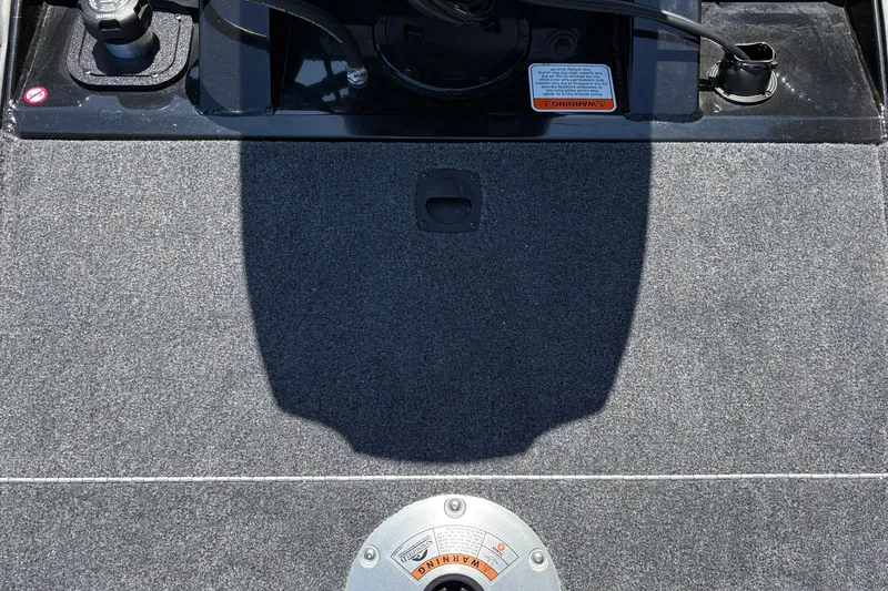 Slide: The Image of 2027 Tracker Pro Team 175 Crappie Edition boat deck with control panel and warning label. - 39