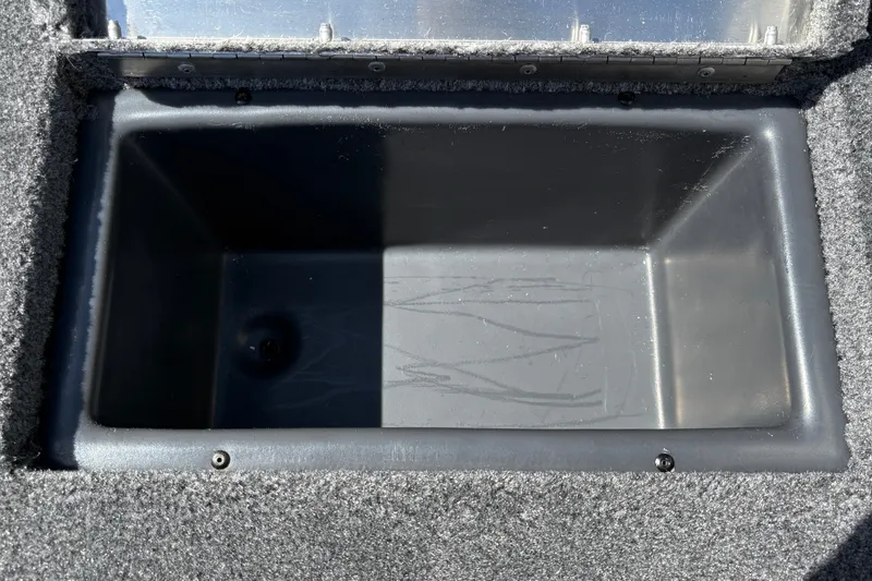 Slide: The Image of Empty storage compartment in 2027 Tracker Pro Team 175 Crappie Edition boat. - 27