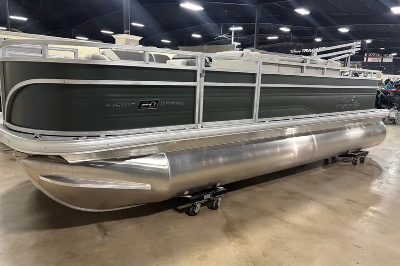 The Image of 2027 Sun Tracker Fishin' Barge 20 DLX pontoon boat displayed indoors. - 0