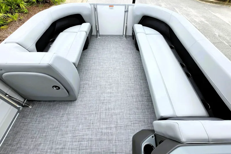 Slide: The Image of 2027 Sun Tracker Party Barge 18 DLX interior with gray seating and flooring. - 17