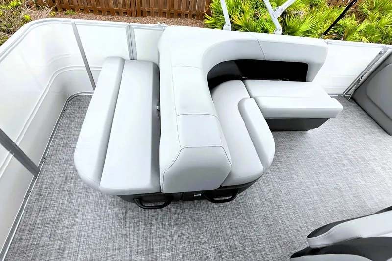 Slide: The Image of 2027 Sun Tracker Party Barge 18 DLX interior with plush seating and modern design. - 16