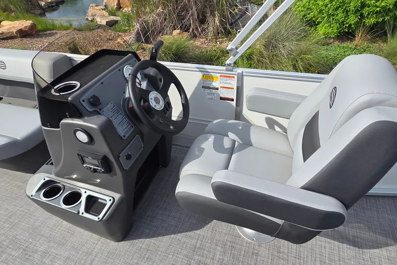 Slide: The Image of Captain's chair and helm of 2027 Sun Tracker Party Barge 16 DLX pontoon boat. - 12