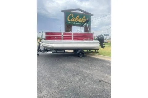 The Image of 2027 Sun Tracker Party Barge 16 DLX pontoon boat displayed at Cabela's parking lot. - 0