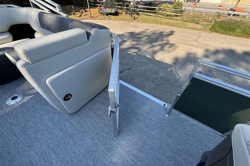 Slide: The Image of 2027 Sun Tracker Fishin' Barge 20 DLX interior with open gate and seating. - 20