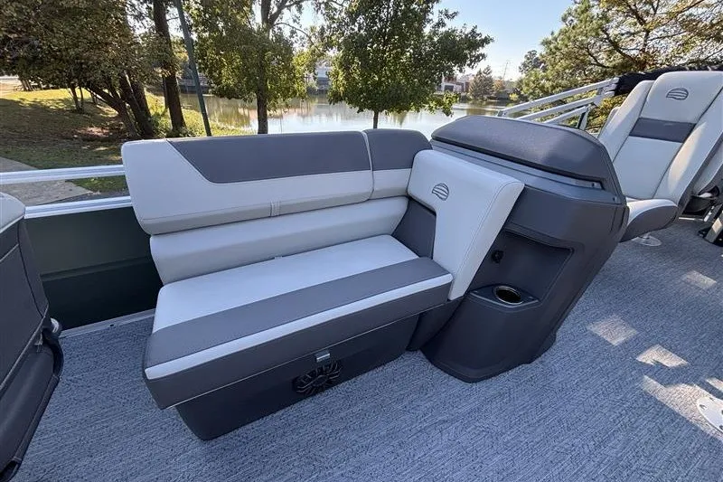 Slide: The Image of 2027 Sun Tracker Fishin' Barge 20 DLX interior seating with lake view. - 16