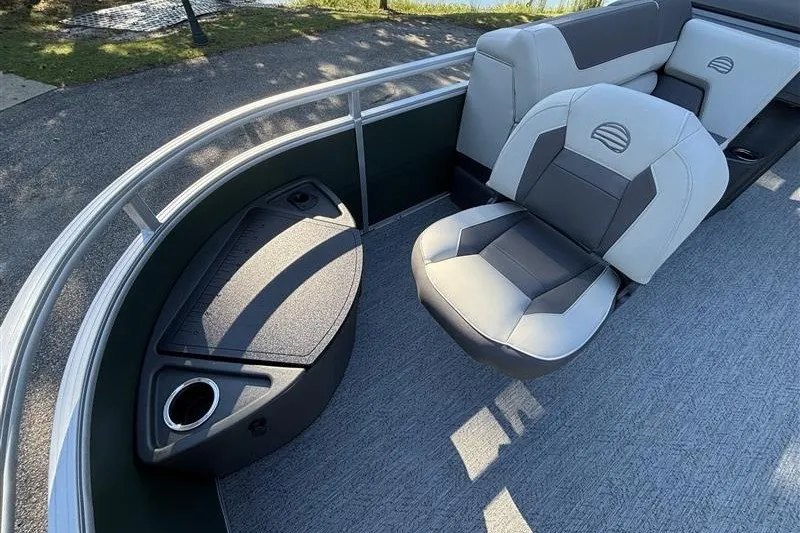 Slide: The Image of 2027 Sun Tracker Fishin' Barge 20 DLX interior with seating and storage. - 14