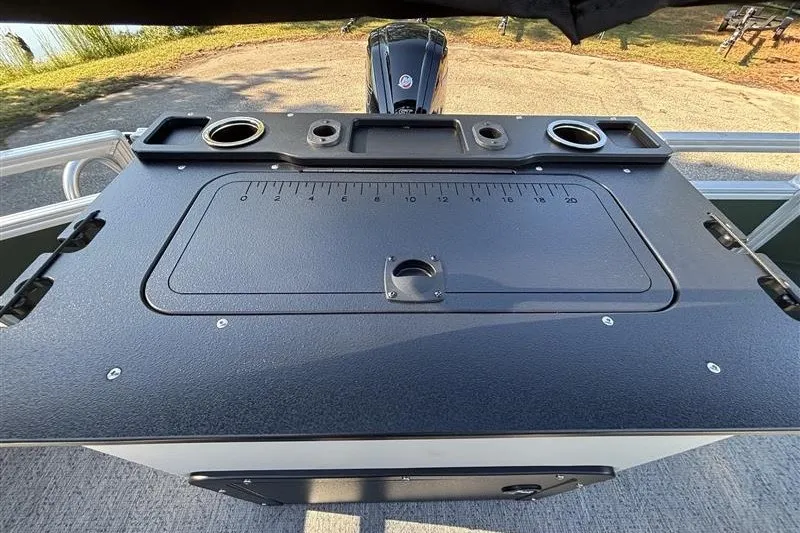 Slide: The Image of 2027 Sun Tracker Fishin' Barge 20 DLX fishing station with ruler and cup holders. - 33