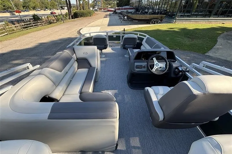 Slide: The Image of 2027 Sun Tracker Fishin' Barge 20 DLX interior with spacious seating and modern helm. - 30