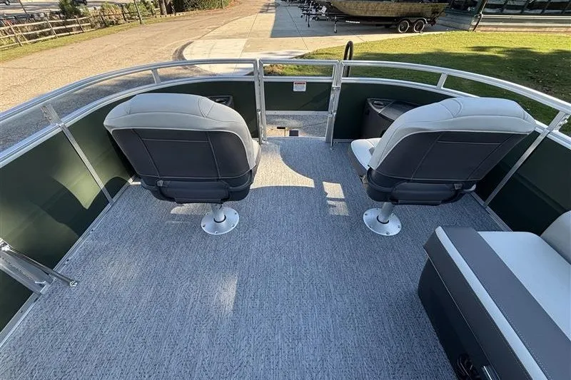 Slide: The Image of 2027 Sun Tracker Fishin' Barge 20 DLX interior with two swivel seats and carpeted deck. - 13