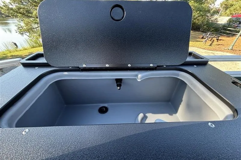Slide: The Image of Open storage compartment on 2027 Sun Tracker Fishin' Barge 20 DLX pontoon boat. - 34