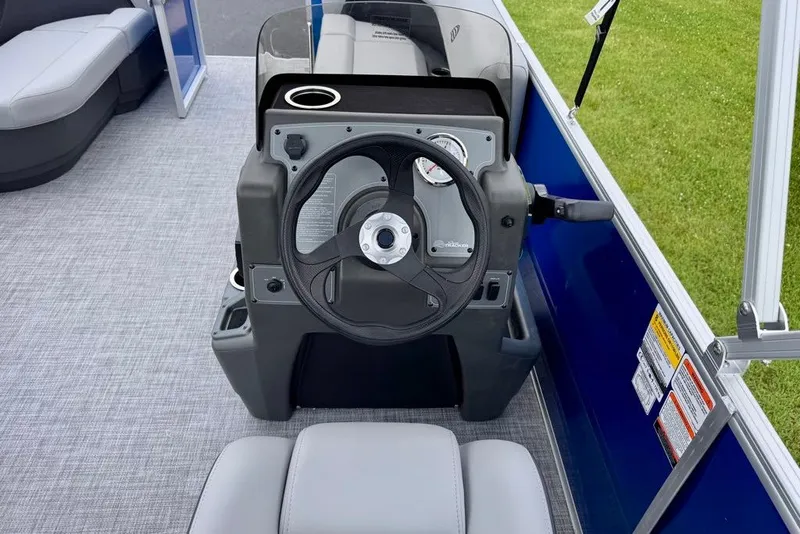 Slide: The Image of Steering console of 2027 Sun Tracker Party Barge 16 DLX pontoon boat. - 17