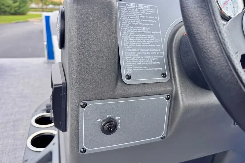 Slide: The Image of Control panel of 2027 Sun Tracker Party Barge 16 DLX with ignition switch and safety instructions. - 18