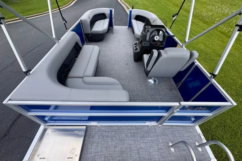 Slide: The Image of 2027 Sun Tracker Party Barge 16 DLX pontoon boat with spacious seating and modern design. - 16