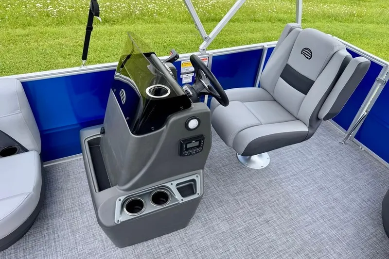 Slide: The Image of 2027 Sun Tracker Party Barge 16 DLX interior with steering console and seating. - 15