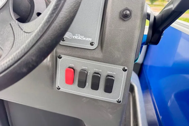 Slide: The Image of Control panel of 2027 Sun Tracker Party Barge 16 DLX with horn and light switches. - 19