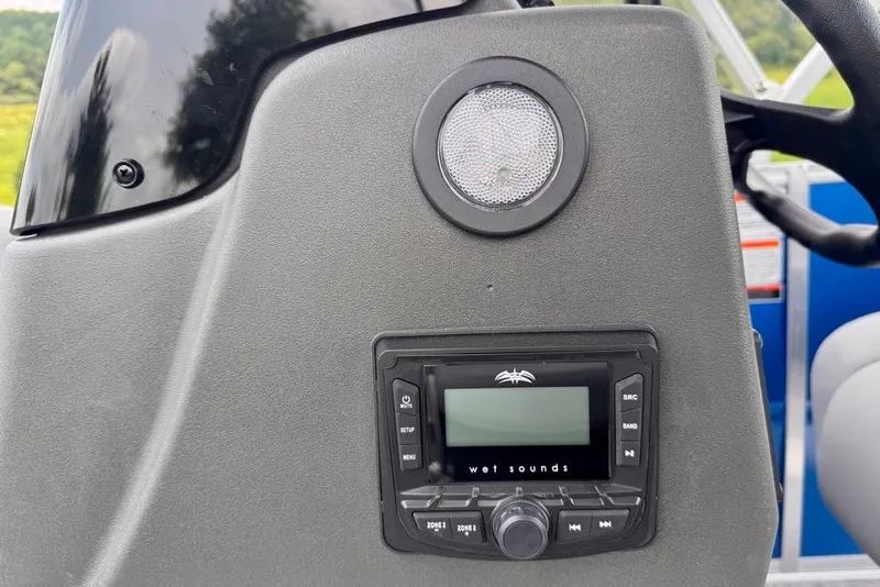 Slide: The Image of Control panel of 2027 Sun Tracker Party Barge 16 DLX with audio system. - 21