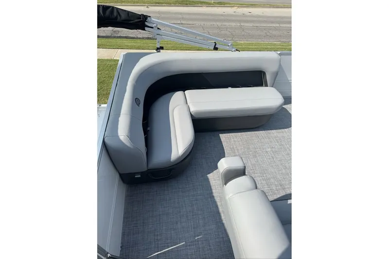 Slide: The Image of 2027 Sun Tracker Party Barge 16 DLX with gray seating and carpeted deck. - 14
