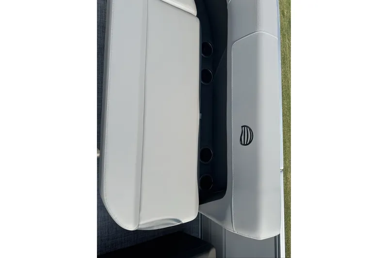 Slide: The Image of 2027 Sun Tracker Party Barge 16 DLX interior seating with cup holders. - 77