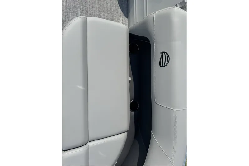 Slide: The Image of 2027 Sun Tracker Party Barge 16 DLX interior seating detail with cup holders. - 78