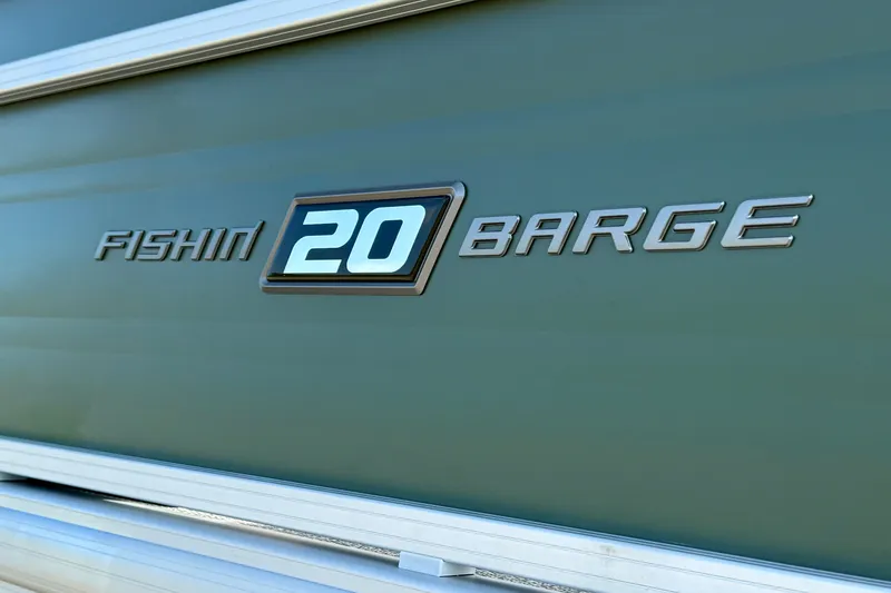 Slide: The Image of 2027 Sun Tracker Fishin' Barge 20 DLX logo on green background. - 17
