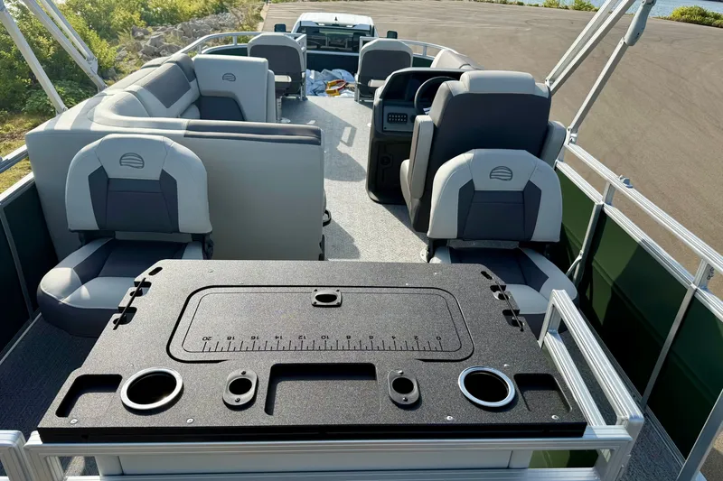 Slide: The Image of 2027 Sun Tracker Fishin' Barge 20 DLX interior with seating and fishing station. - 15