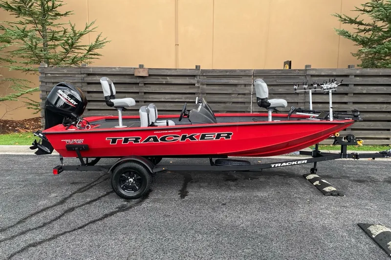 The Image of 2027 Tracker Pro Team 175 Crappie Edition boat, red, parked on trailer. - 0