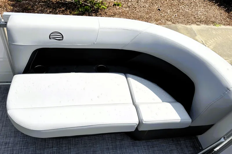 Slide: The Image of Luxurious seating on 2027 Sun Tracker Party Barge 16 DLX with water droplets. - 16