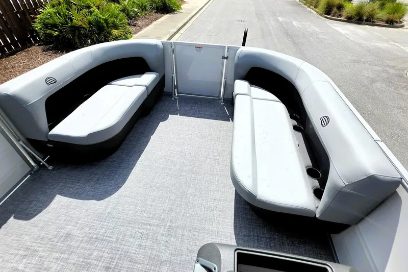 Slide: The Image of 2027 Sun Tracker Party Barge 16 DLX interior with gray seating and spacious layout. - 15