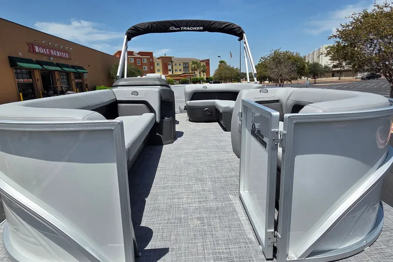Slide: The Image of 2027 Sun Tracker Party Barge 18 DLX pontoon boat with open seating and canopy. - 13