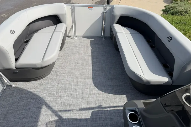 Slide: The Image of Interior of 2027 Sun Tracker Party Barge 16 DLX with gray seating and cup holders. - 14