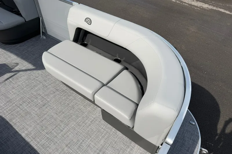 Slide: The Image of Sun Tracker Party Barge 16 DLX 2027 pontoon boat seating area with gray upholstery. - 13