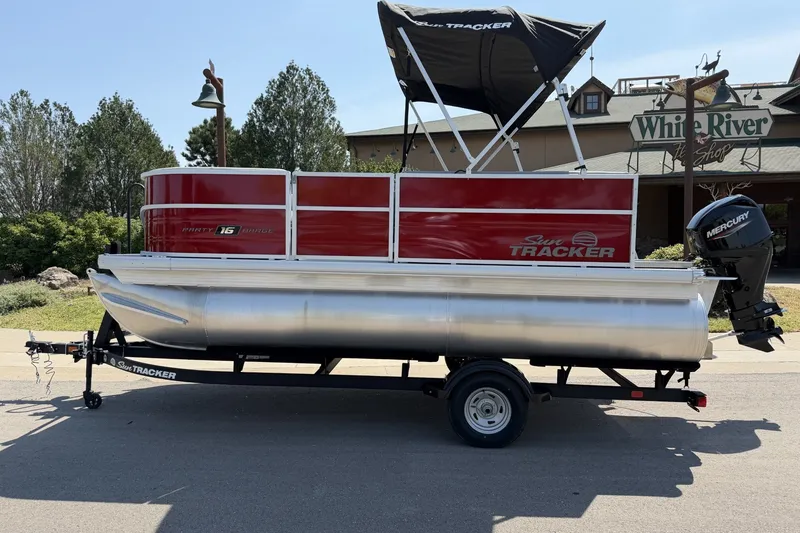 The Image of 2027 Sun Tracker Party Barge 16 DLX pontoon boat with Mercury outboard motor. - 0