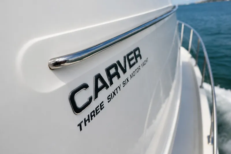 Slide: The Image of 2004 Carver 366 Motor Yacht cruising on open water, showcasing sleek design. - 22