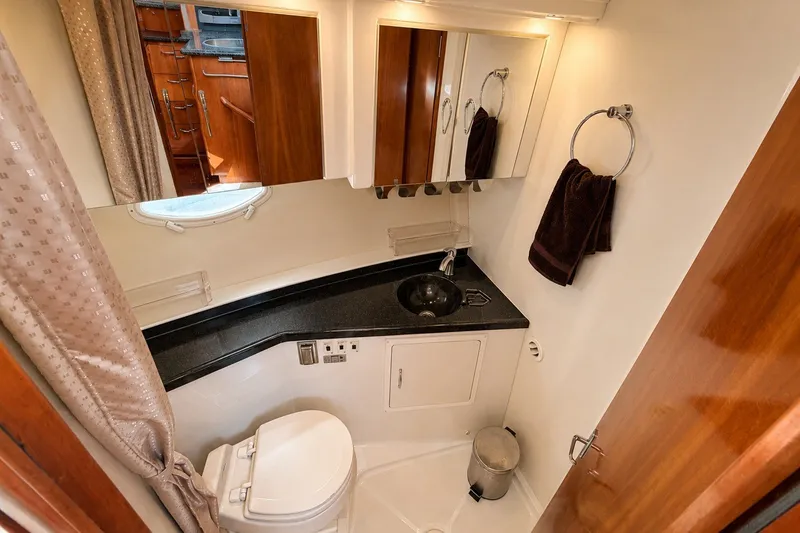 Slide: The Image of Bathroom interior of 2004 Carver 366 Motor Yacht with sink, toilet, and mirror. - 16