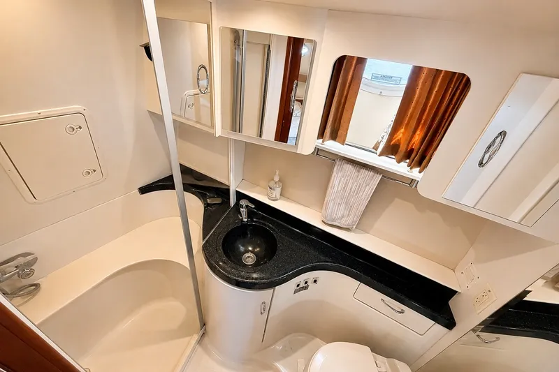 Slide: The Image of Luxurious bathroom in 2004 Carver 366 Motor Yacht with modern fixtures and elegant design. - 17