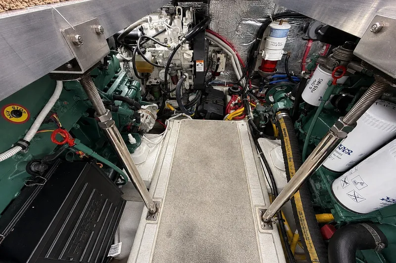 Slide: The Image of Engine room of a 2004 Carver 366 Motor Yacht, showcasing mechanical components. - 19