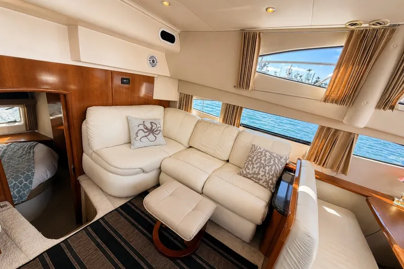 Slide: The Image of Luxurious interior of 2004 Carver 366 Motor Yacht with plush seating and elegant decor. - 13